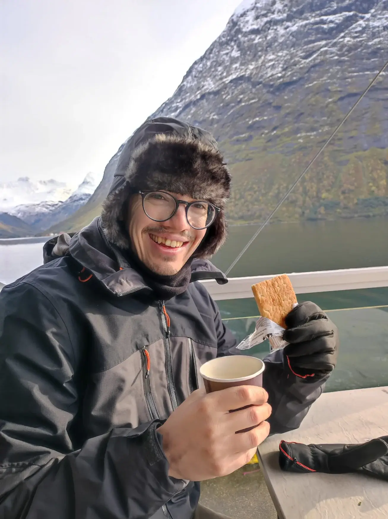 Daniele holding a cup of coffee