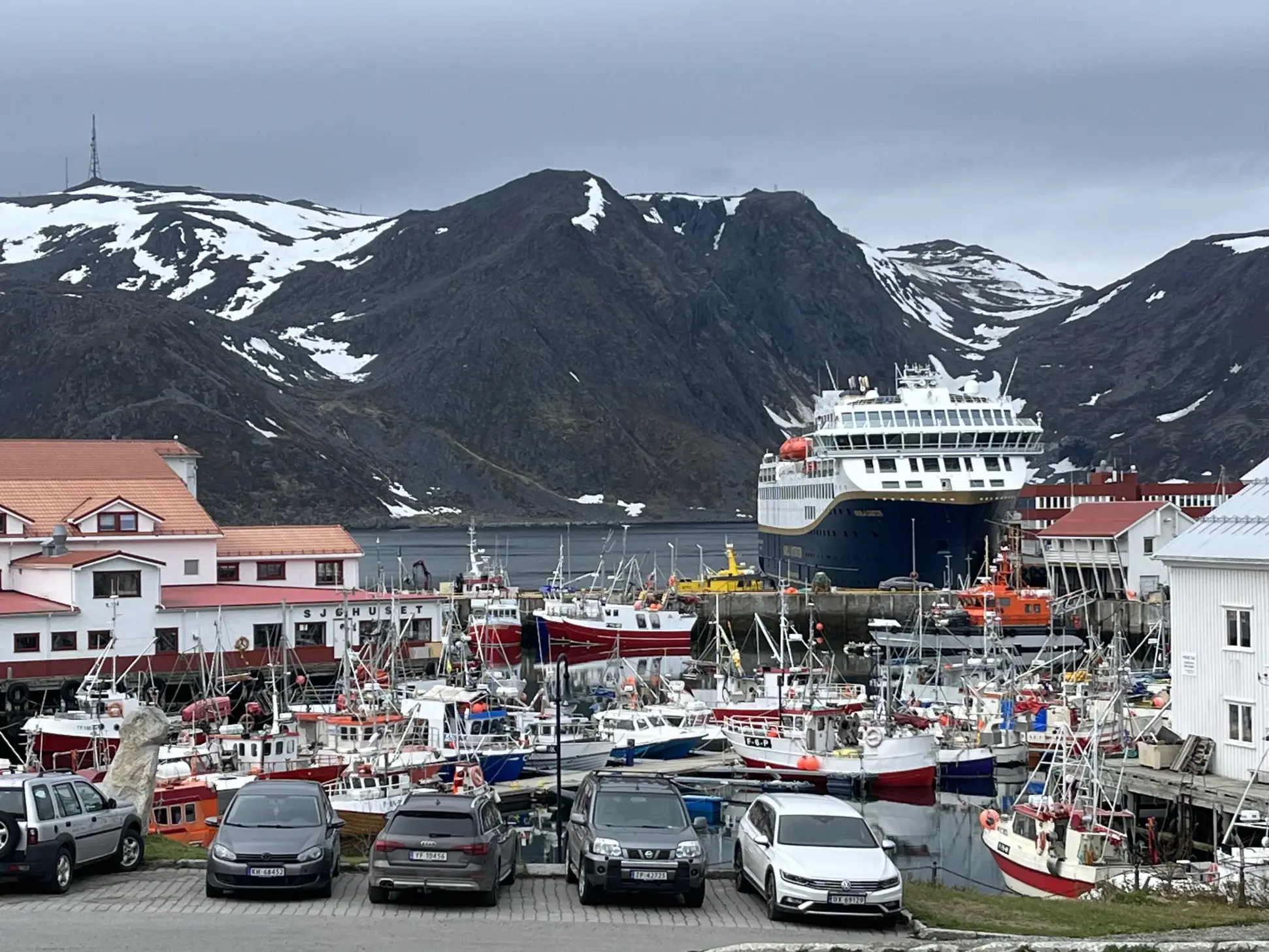 Havila Voyages by a pier