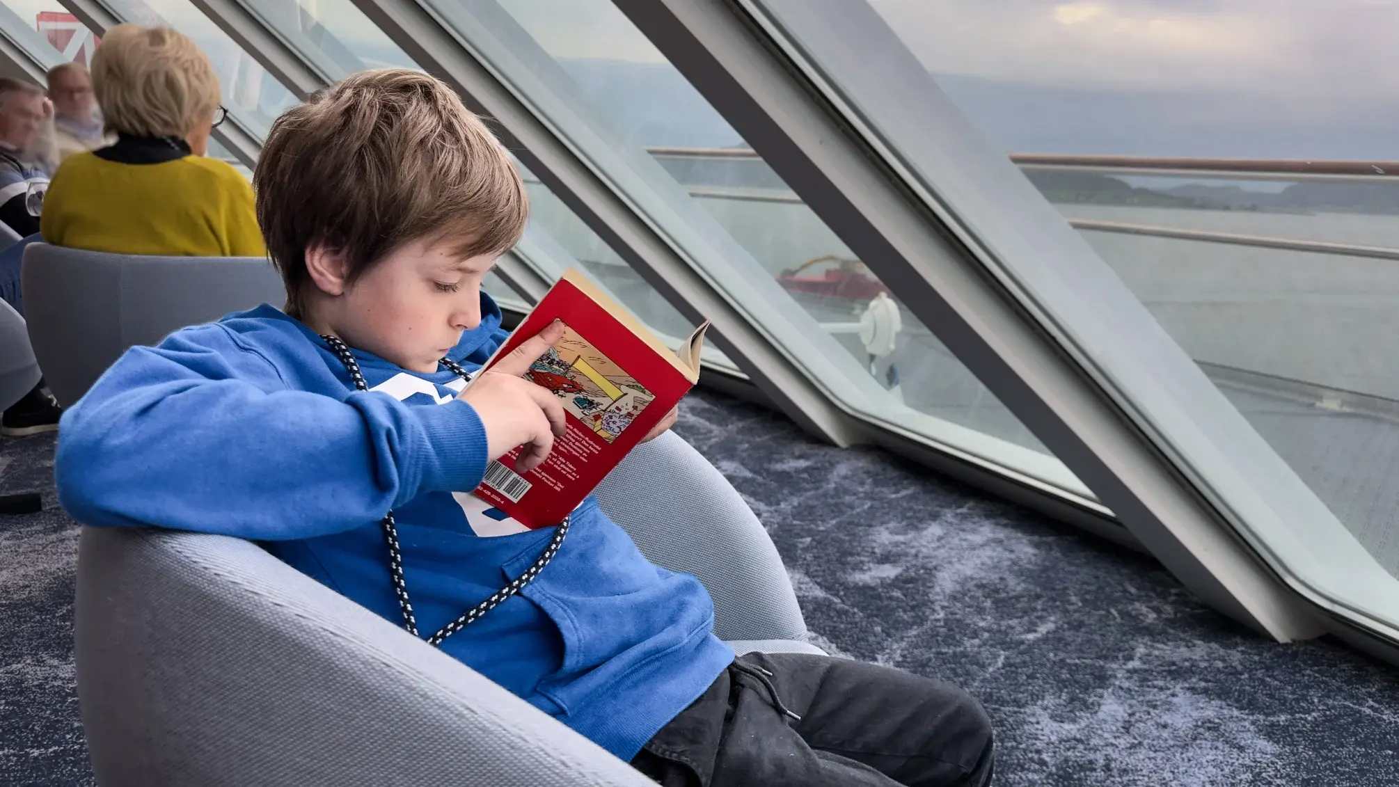 Young boy reading a book