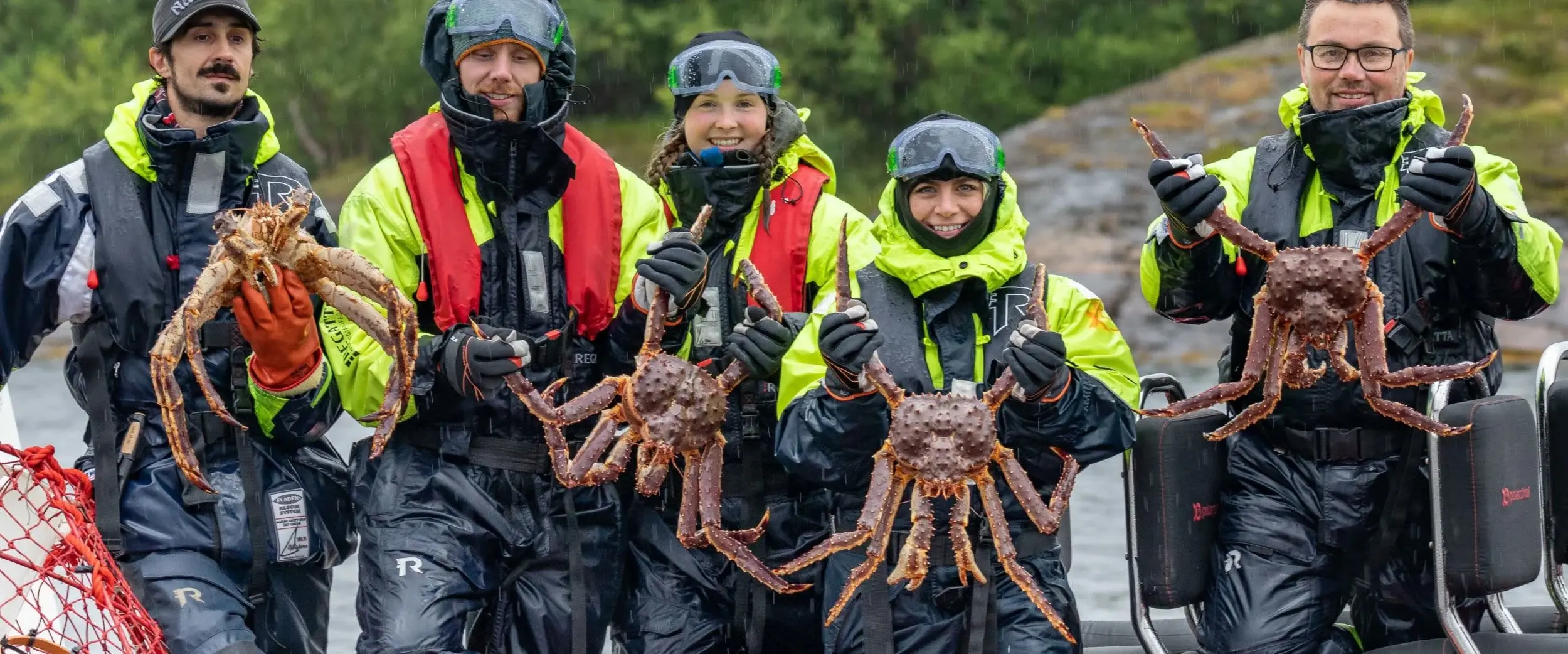 People showing cing crabs