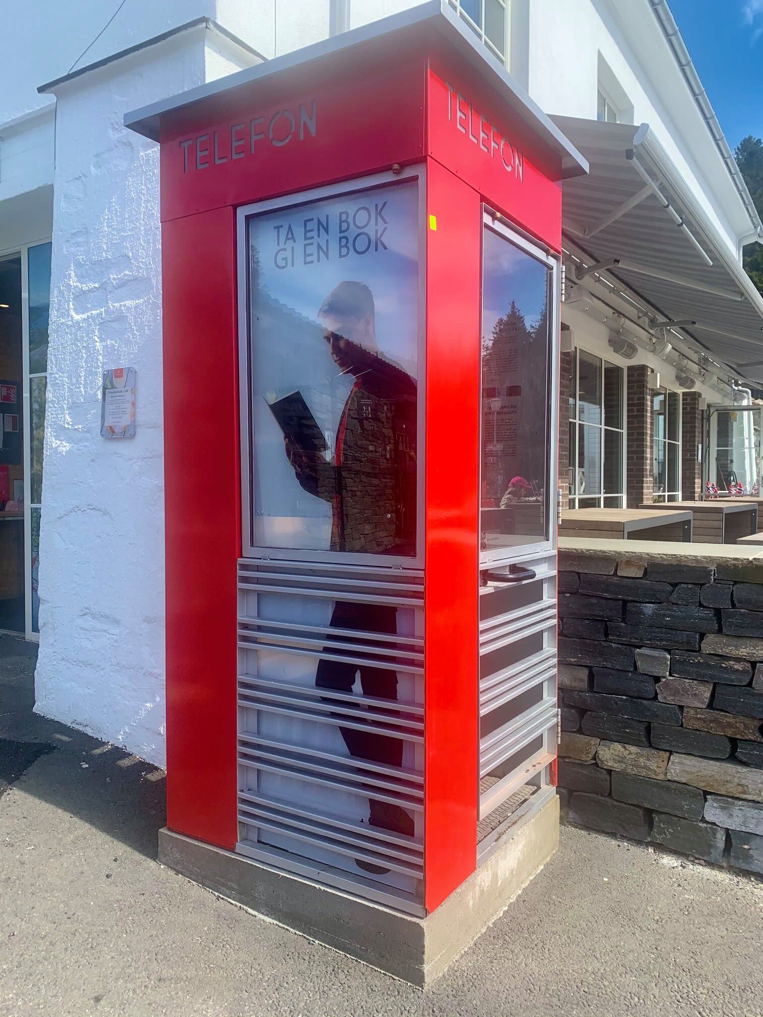 Reading nook inside a vintage telephone booth