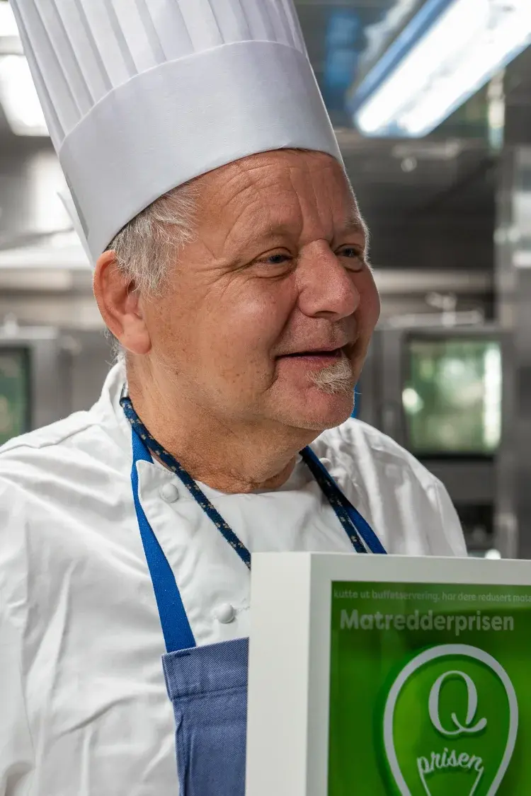 Kitchen Manager holding the prize