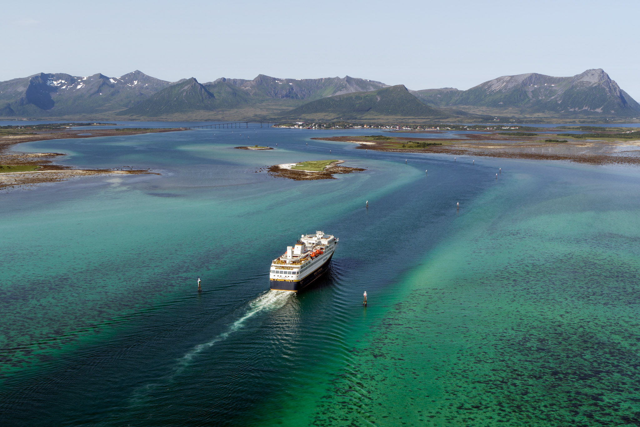 Havila Voyages sailing through crystal-clear waters