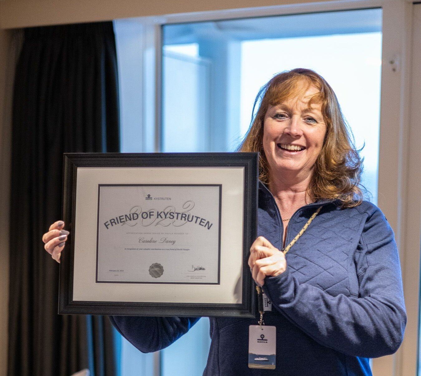 Caroline Davey showing her diploma