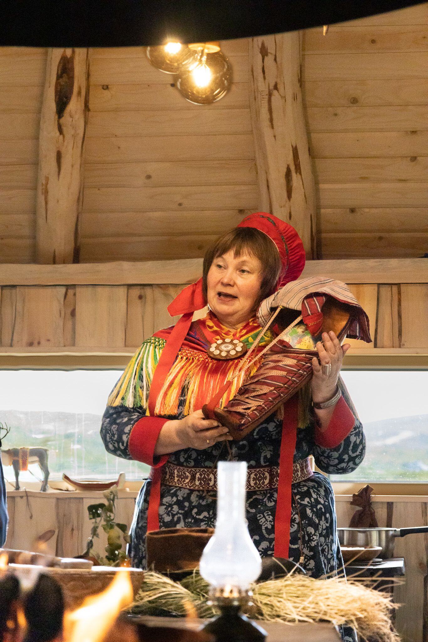 A sámi woman showing her culture