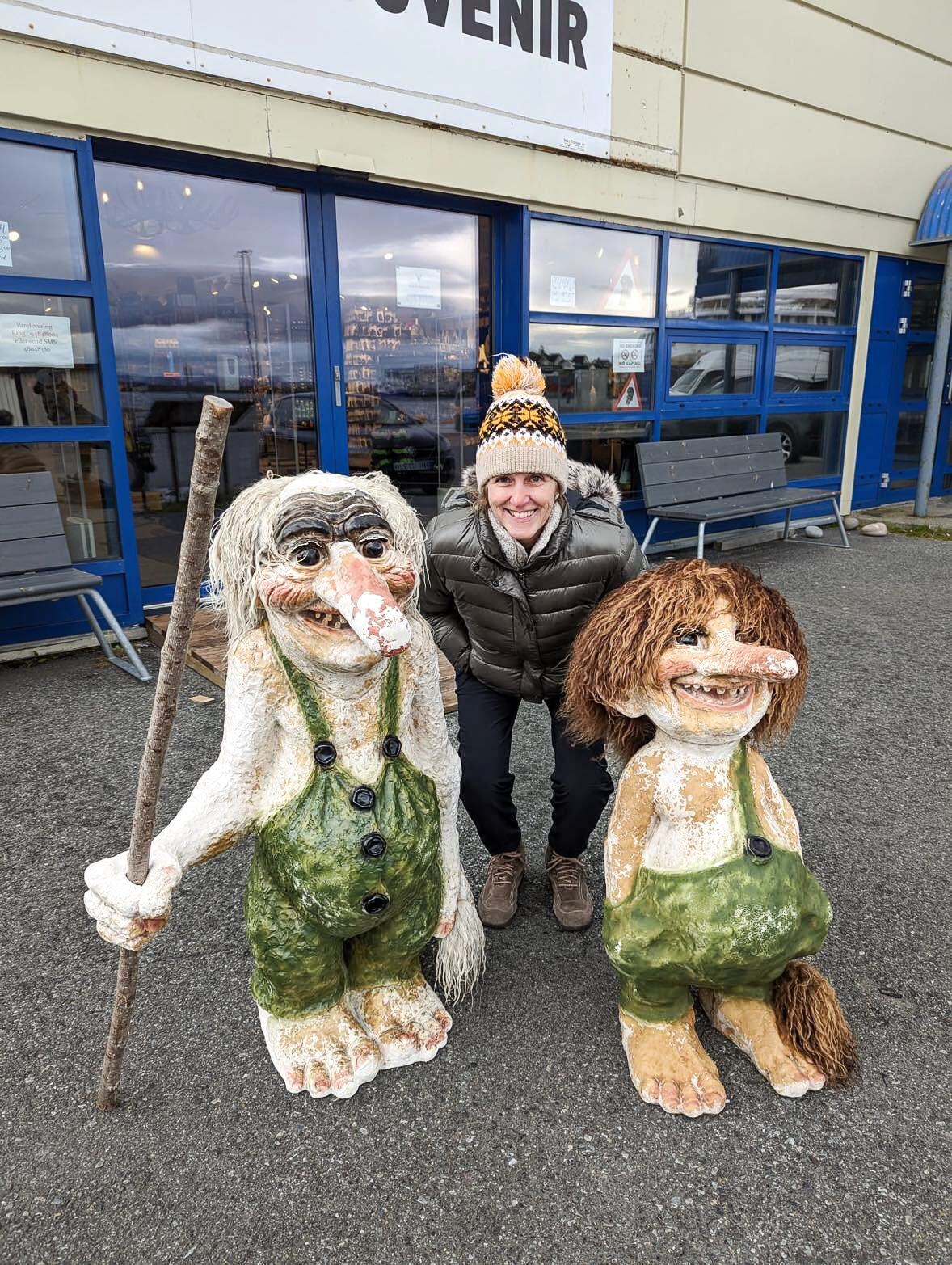 Vicky posing with troll sculptures